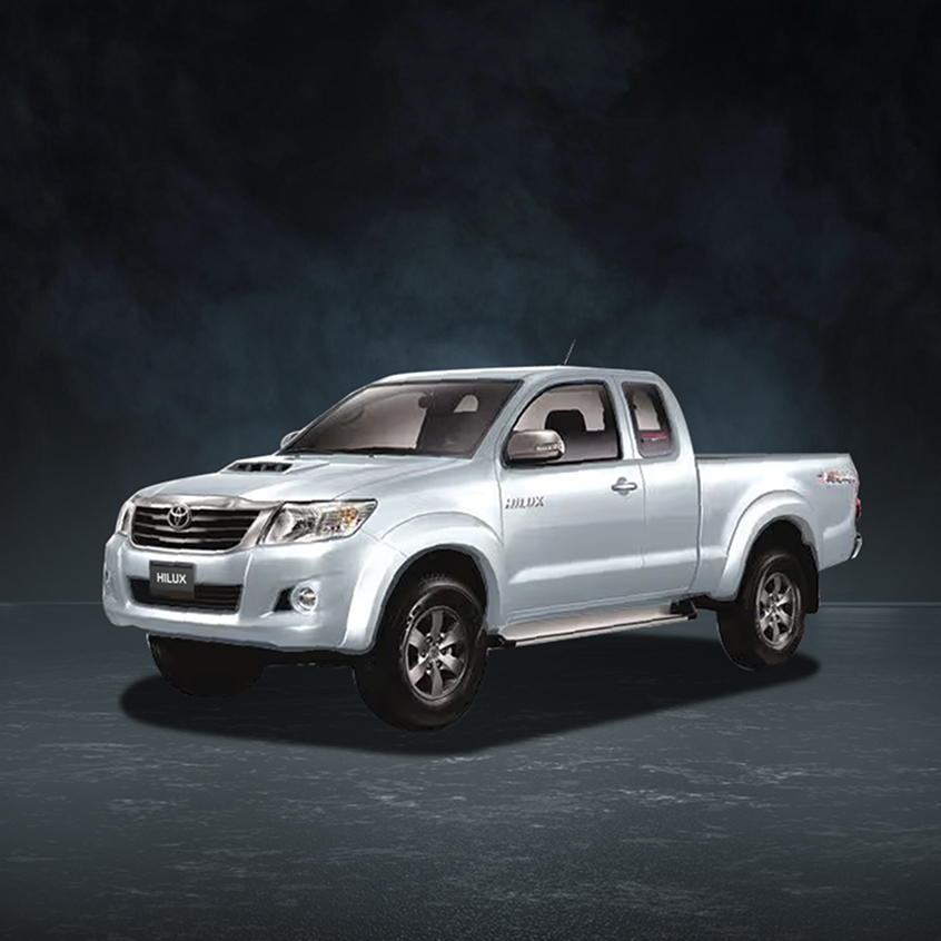 Silver Toyota Hilux pickup truck with extended cab and rugged design, studio front-side view.