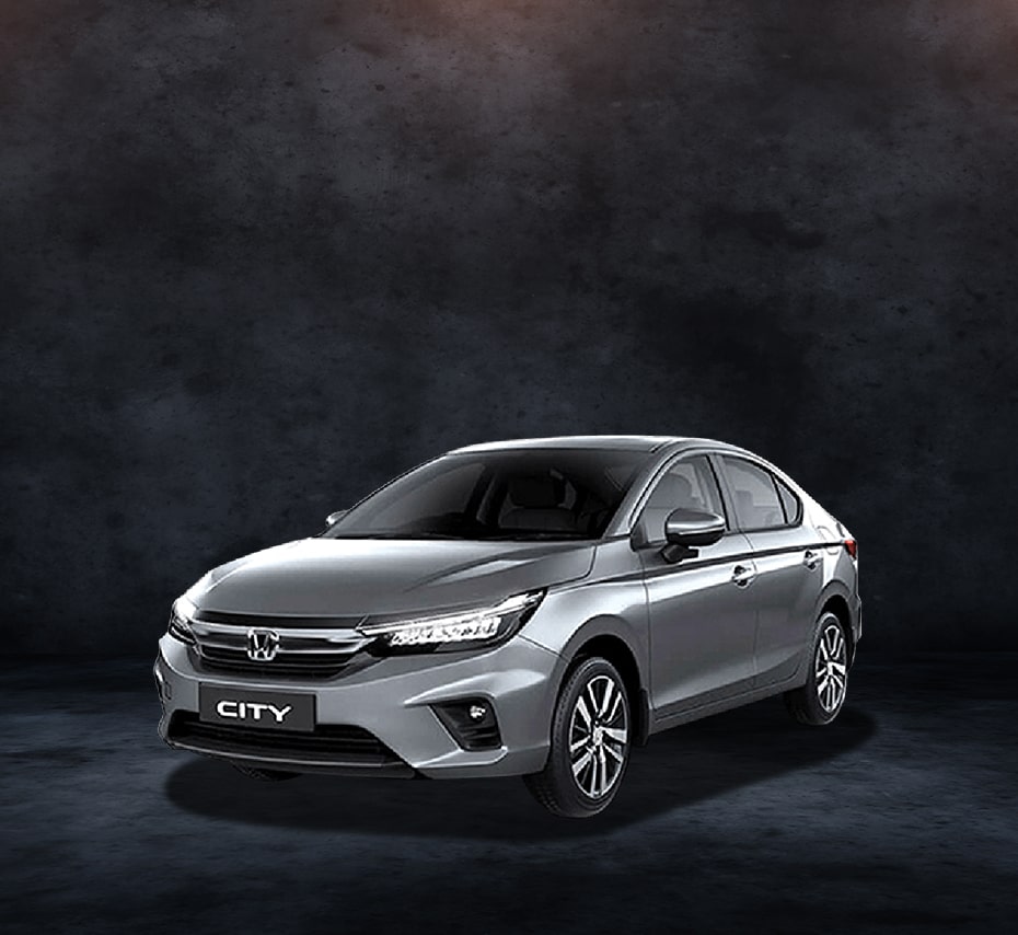 Silver Honda City sedan with LED headlights and alloy wheels, studio front-side view.