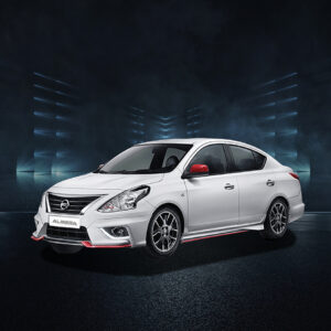 White Nissan Almera sedan with red accents and sport rims, studio front-side view.