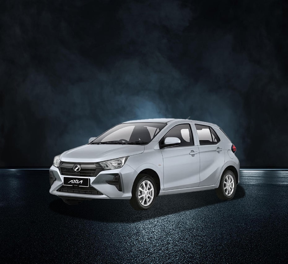 Silver Perodua Axia hatchback in studio with dark background, front-side view.