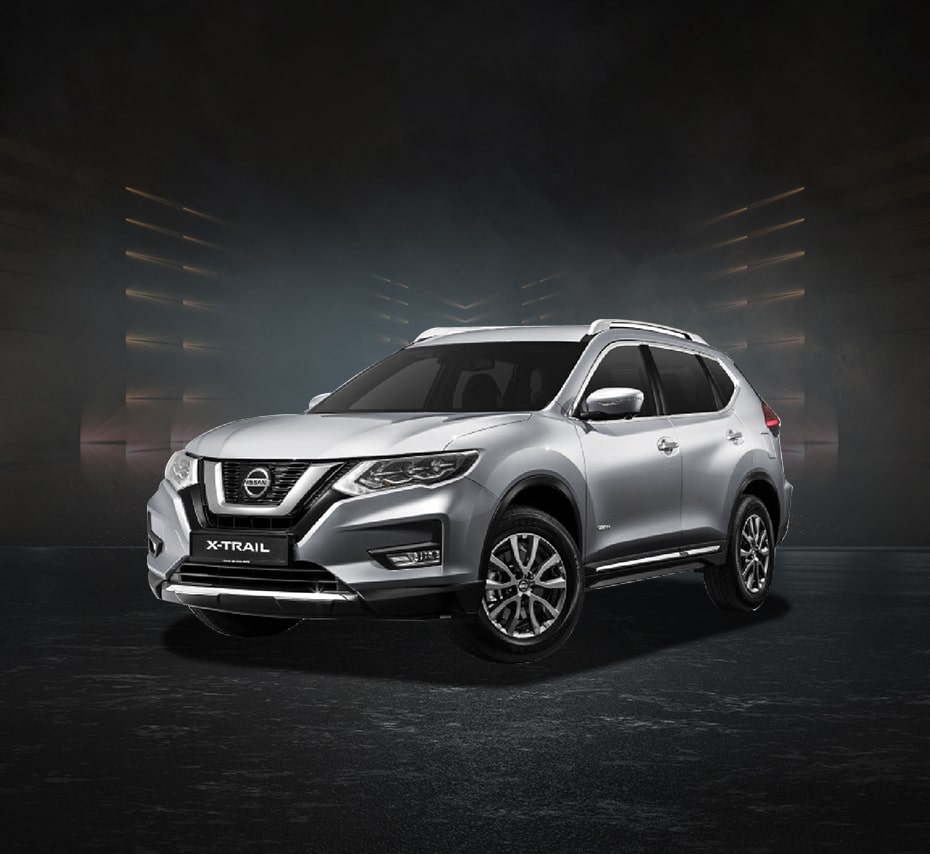 Silver Nissan X-Trail SUV with bold grille and roof rails, studio front-side view.