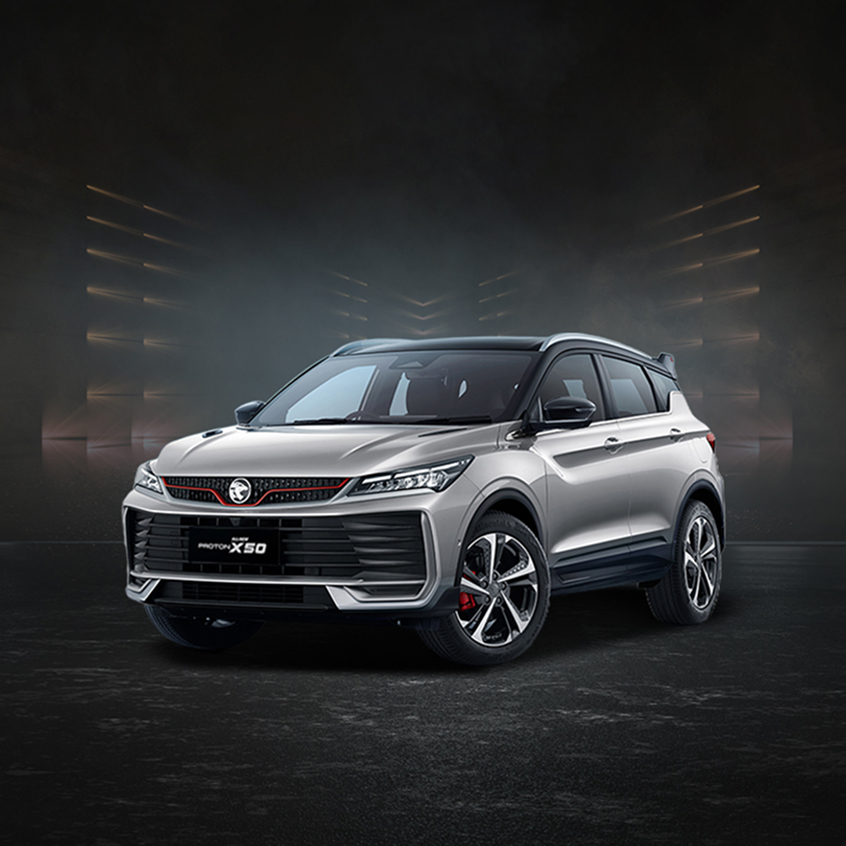 Silver Proton X50 compact SUV with sporty grille, red accents, and alloy wheels, studio front-side view.